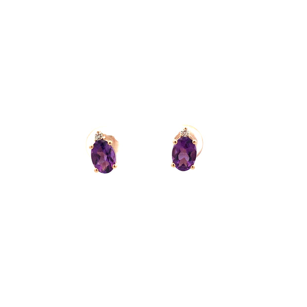 14kt Yellow Gold Studs With 2 5X7 Oval Amethyst At 1.47tcw And 2 Round