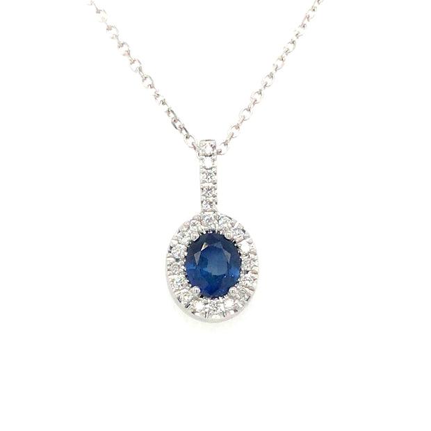 14Kt White Gold Pendant With Oval .48 TGW Sapphire And Bail And Halo O